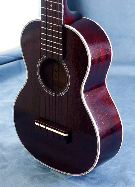 �߂�