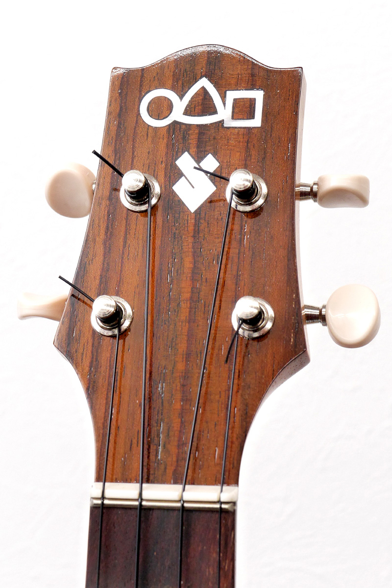 �߂�
