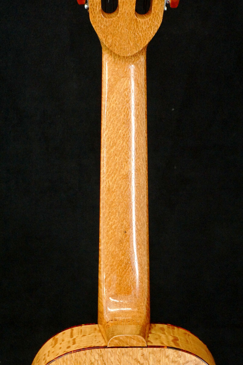 �߂�