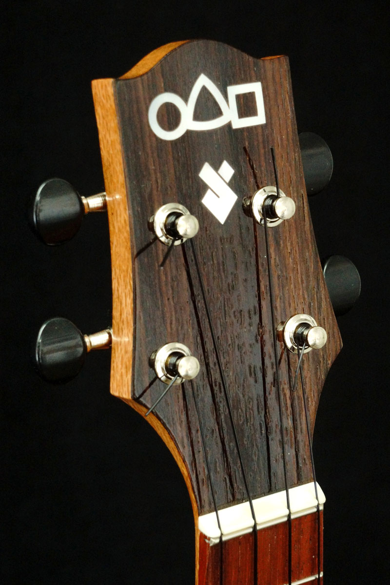 �߂�